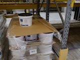 boxes of paint are stacked on a pallet in a warehouse