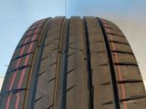 a close up of a tire with a red stripe on it