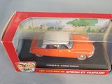 toy car in a box sitting on a table in front of a white background