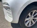 a close up of a car ' s front bumper and tire