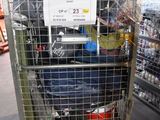 a metal cart with luggage in it in a store