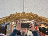a man taking a picture of himself in a mirror