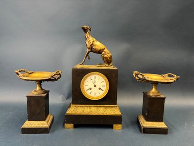 three pieces of art that include a clock and a statue of a dog