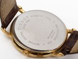 an image of a close up of a watch on a white surface