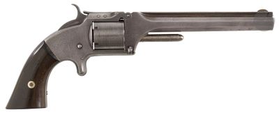an old revolver with a wooden handle on a white background