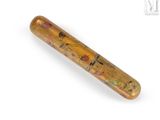 a wooden bat with a design on it on a white surface