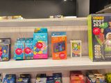 a lot of children ' s toys on the shelves in the store