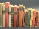a lot of books that are lined up on a table
