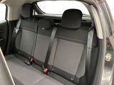 four seats in the back of a car that are empty