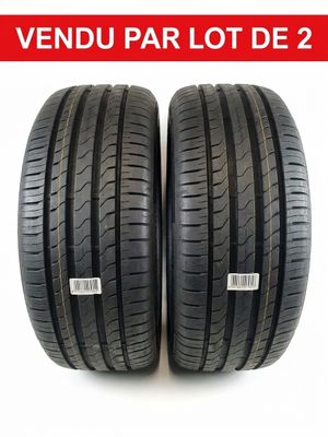 a pair of tires on a white background with the words vendu par lot de 2