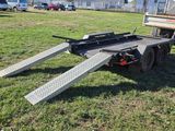 a truck with a ramp attached to the back of it