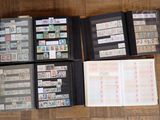 many different types of stamps in a folder on the floor