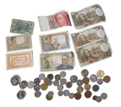 many different types of money and coins on the table