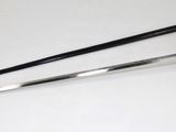 two swords sitting on a table next to each other