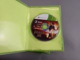 an xbox game in a green case with a disc in it