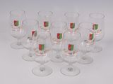 six wine glasses with a red and green label on them