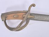 a close up of a sword with a wooden handle