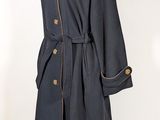 an image of a coat on a mannequin stand