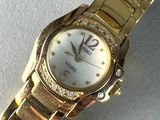 an image of a close up of a wrist watch on a table