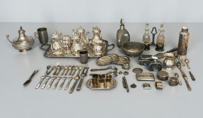 a lot of silver items that are on a table