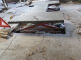 a picture of a room that has a lot of debris on the floor