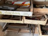 a pile of old boxes and other items in a room