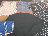 a table with a lot of clothes on it