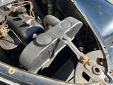 a close up of a car ' s engine in the back of the car