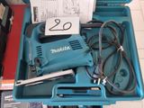 a blue box with a tool in it on a table