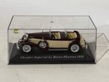 a model of an antique car in a display case