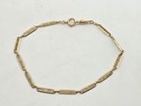 an image of a gold bracelet with a link on a white background