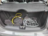 a trunk of a car with a bunch of wires in it