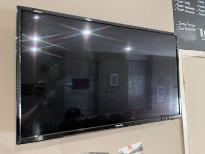 a flat screen tv mounted on the wall in a room