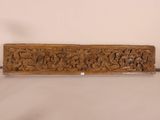 an old carved wooden door handle with a floral design