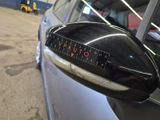 a close up of a car ' s side mirror with a speedometer on it