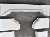 four pieces of white marble on the ground