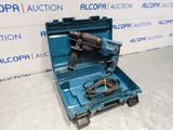an electric drill in a blue case with a cord in it