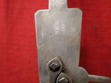 a metal tool that has a handle on it