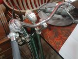 a bike that is sitting on a table next to a basket
