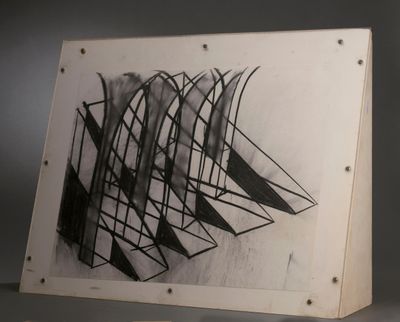 a black and white picture of a piece of art on a table