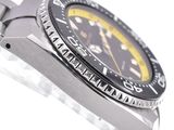 a close up of a watch on a white surface