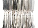 a lot of silver spoons stacked on top of each other
