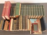 a lot of books that are sitting on a table