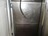 an image of a stainless steel washer in a bathroom