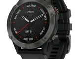 the garmin gps watch has a black band and a red second hand