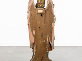 an image of a wooden sculpture of an angel on a pedestal