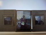 two old photos of a woman and a man on a shelf