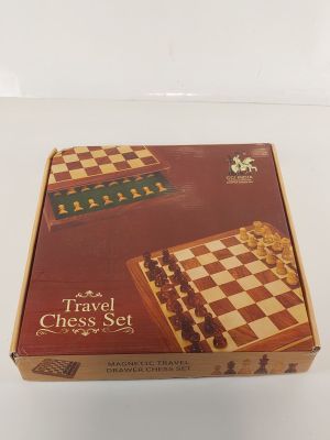 the travel chess set is in its box on the table
