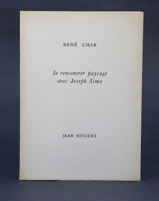 a white book with black writing on it sitting on a table