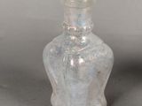 a small glass bottle that is sitting on a table